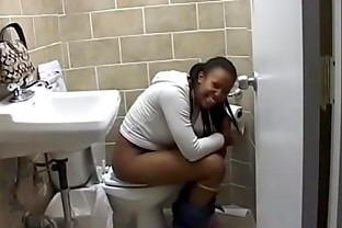 Black beauty takes off her lace panties and pee in the bathroom 6 min