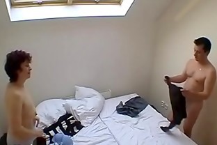Swinger couple fucking in a room