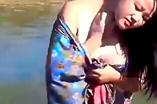 Girl Enjoying in River at jungle