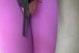 Blond girl pees her spandex leggings outside
