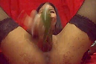 Angel asian taking cucumber