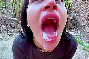 Sucking in public outdoors near people and getting hot sticky cum in her mouth