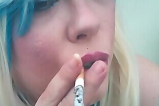 A Blonde BBW Mistress Tina Snua Smoking A Cork Cigarette With Drifts