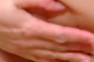 Cute solo girl masturbates in bed