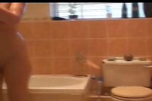 Blonde in shower takes a hot piss