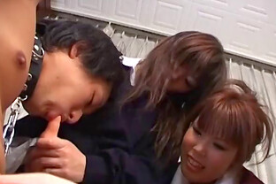 Japanese girls play with his hard cock in a threesome