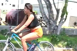 Girl on a bike with her ass up