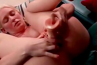 Solo blonde with a nice bush fingers her cunt
