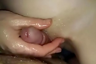 Rubbing her pussy with oil